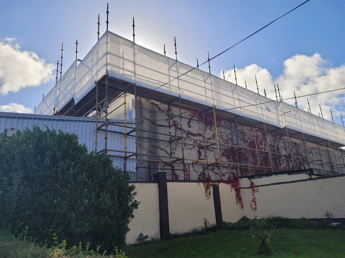Professional asbestos removal preparation at Galway property - HSA licensed specialists in full PPE equipment setting up containment zone